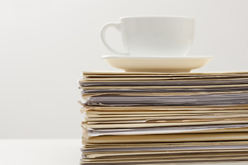 Files and coffee on desk