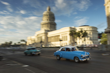 Panning with old car on streets of Havana, Cuba
