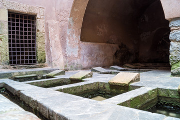 Picturesque cluster of 16th-century wash basins in Cefalu, Sicil