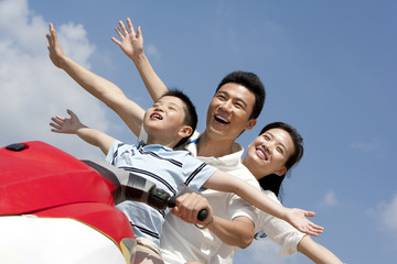 Happy family riding on a jet ski