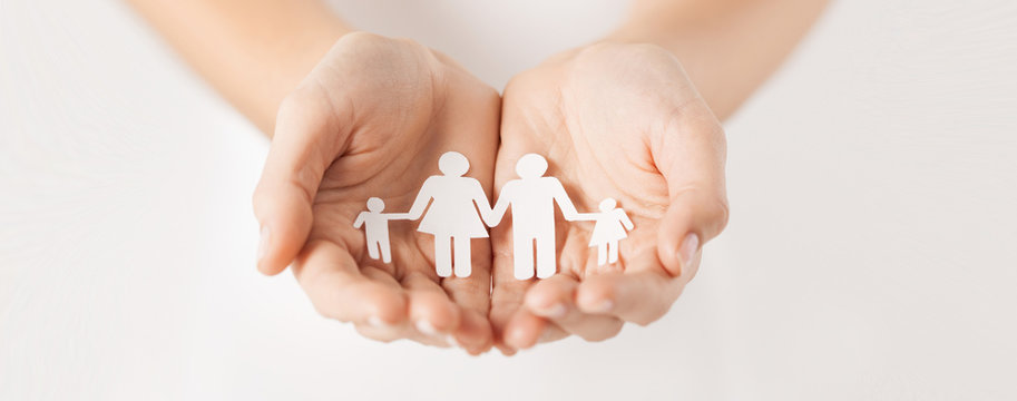 woman hands with paper man family