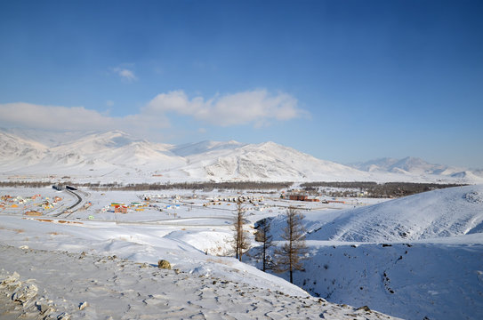 Snow-covered hills. Mongolian winter landscape