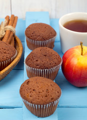 Chocolate cakes, tea and apples