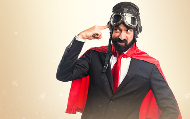 Super hero businessman making crazy gesture