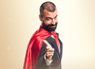 Super hero businessman with thumb up