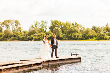 wedding couple  near water
