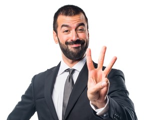 Businessman counting three