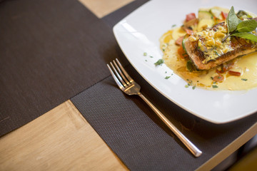 Grilled salmon with sauce and herbs