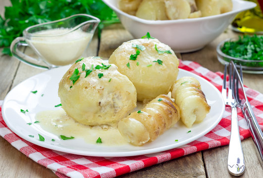 Potatoes stuffed with minced meat in heavy cream souce