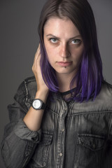 Violet haired gothic girl posing in studio