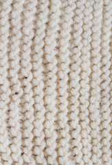 White knitted texture with a vertical pattern