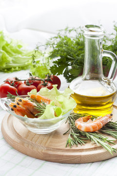 Tiger Prawn Shrimps with green lettuce and rosemary. Prawn Shrimps with green lettuce and rosemary in glass plate.