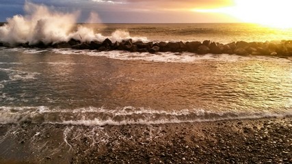 Dramatic and romantic sunset with rough sea