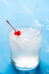 Old fashioned cocktail with cherry