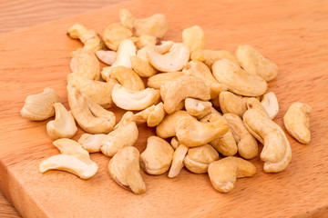 Cashew nuts on a kitchen board