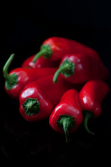 red peppers isolated on black