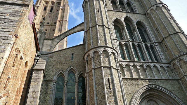 Gothic facade and tall belfry of the Church of Our Lady, Bruges, Belgium.