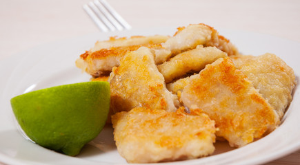 fried pieces of fish fillets