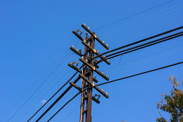 electricity post in blue sky