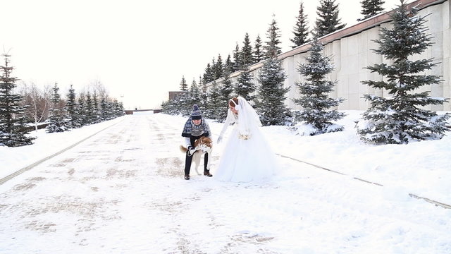 Wedding couple winter walking