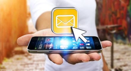 Young man using modern mobile phone to send message