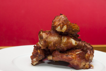 Roasted pork ribs on a white plate