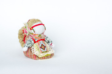 Doll amulet on a white background
