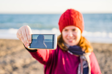 Young woman taking selfie