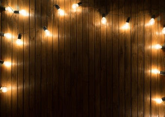 Light bulbs on dark Wooden Background