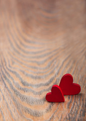 Fototapeta premium Hearts on a wooden background