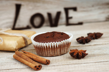 Chocolate muffin, gift box and word love