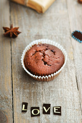 Chocolate muffin, gift box and word love