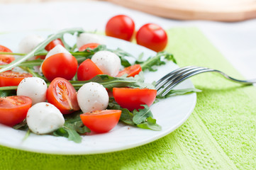 Vegetable salad of arugula and cherry