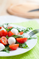 Salad of arugula, cherry tomatoes and mozzarella