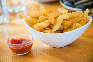 Homemade potato fries with tomato sauce