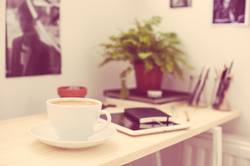 Cup of coffe in modern loft-style office