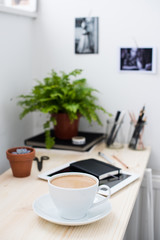 Cup of coffe in modern loft-style office