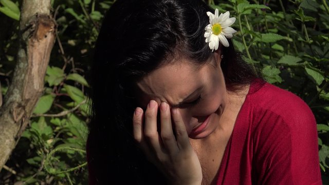 Latin Woman Crying in Nature