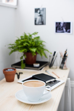 Cup of coffe in modern loft-style office © Daria Minaeva