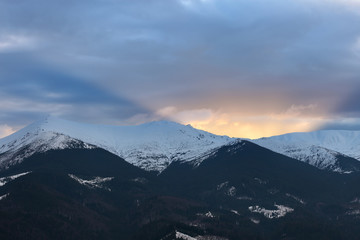 Fototapeta na wymiar Sunset over winter mountain ridge
