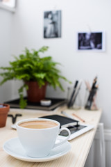 Cup of coffe in modern loft-style office