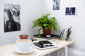 Cup of coffe in modern loft-style office