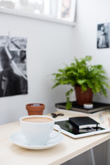 Cup of coffe in modern loft-style office