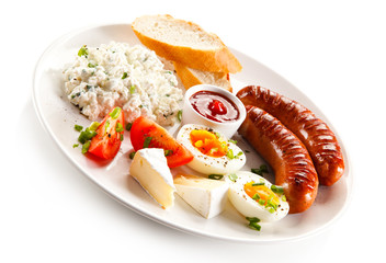Breakfast - boiled egg, fried sausages, cottage cheese and vegetables
