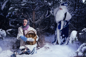 Morozko. Ded Moroz (Father Frost) and girl in the winter forest