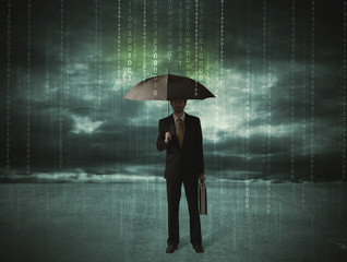 Business man standing with umbrella data protection concept
