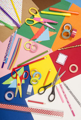 Arts and craft supplies.  Corrugated color paper, pencils, different washi tapes, craft scissors.