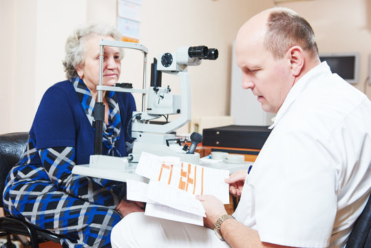 Male ophthalmologist or optometrist at work