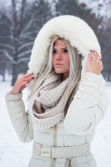 Beautiful woman wearing fur hood