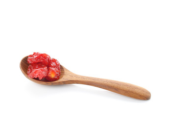 Wooden spoon with dried tomato on white background